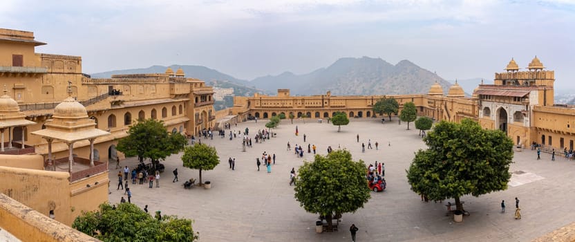 Jaipur, India - December 12, 2019: People in the courtyard at historic Amber Fort