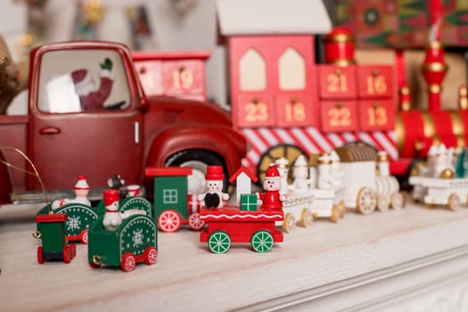 Wooden toy train. Christmas trip on a white isolated background. Christmas card. Copy space.