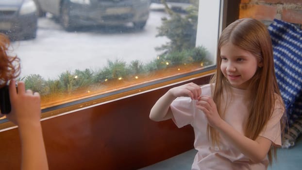 Cute couple of kids in cafe. Stock footage. Beautiful couple of kids on date in cafe. First love of children on date in cafe.