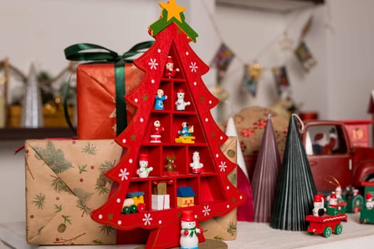 Wooden toy houses and christmas candlestick on store showcase decorating for New Year and Christmas