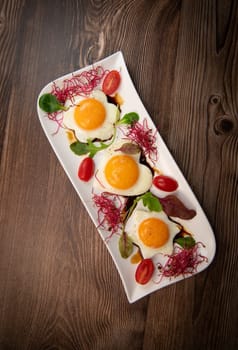 RECIPE FOR FRIED EGGS AND POMEGRANATE MOLASSES CUT INTO HEARTS, STARS AND FLOWERS. High quality photo