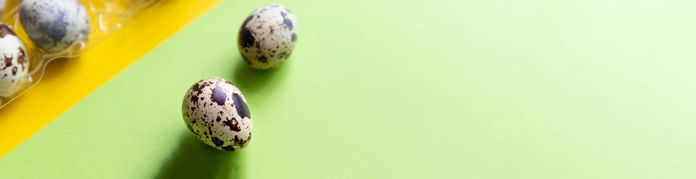 Creative quail egg layout on brown background. Quail eggs pattern. Happy easter concept.