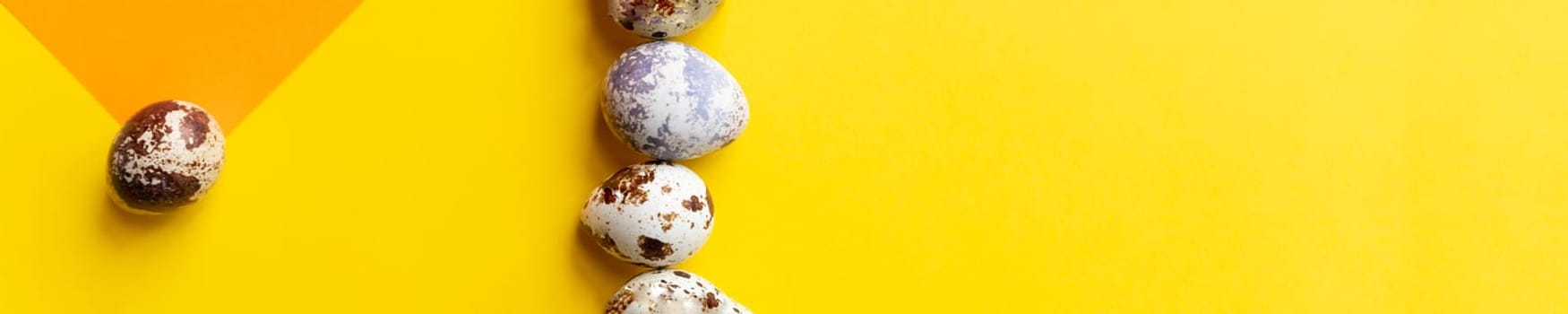 Creative quail egg layout on brown background. Quail eggs pattern. Happy easter concept.