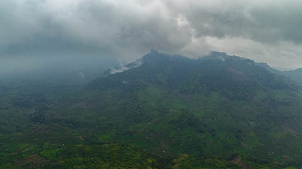 Aerial view of tropical landscape with mountains and jungle in Sumatra, Indonesia.