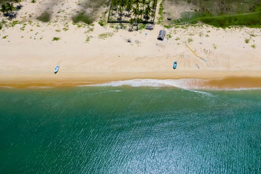 Aerial drone of Seascape with tropical sandy beach and blue ocean.