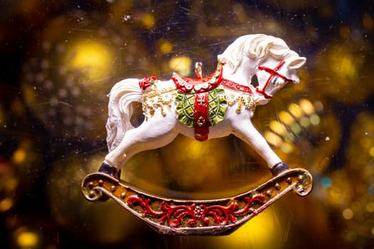 new year retro toy horse on a golden background.