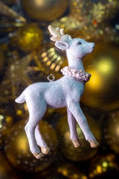 christmas tree toy white fawn on the background.