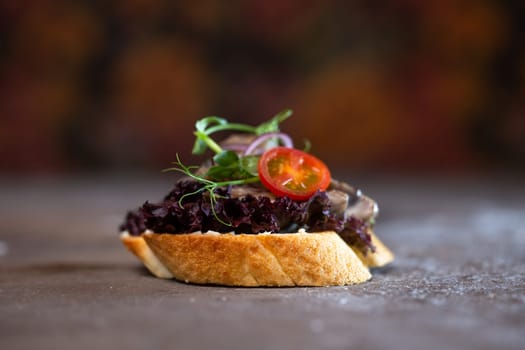 close-up bruschetta with mushroom sauce and tomato.