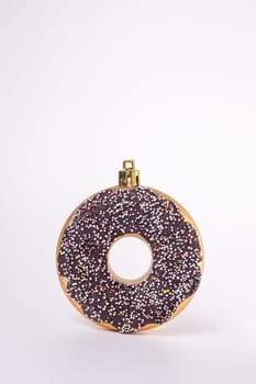 decor Christmas toy in the shape of a donut on a white background.