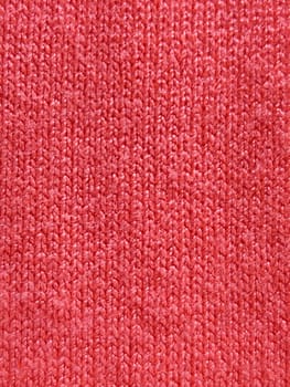 pink knitted jersey, warm texture for background.