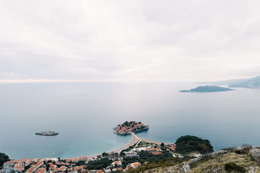 Island of Sveti Stefan in the Bay of Kotor, connected by an isthmus to the mainland. Top view. Montenegro. High quality photo
