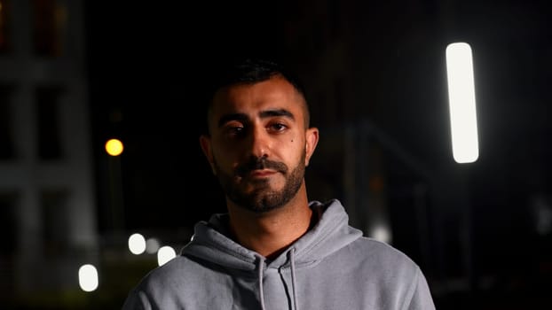 Night portrait with a gloomy man. Media. Late evening with a handsome well-groomed man who frowns. High quality 4k footage