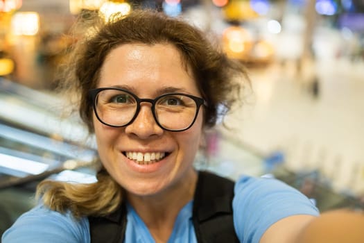 Video call portrait of excited cheerful smiling woman in spectacles taking selfie photo. Selfie and blogger