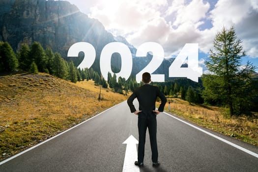 2024 New Year journey and future vision concept . Businessman traveling on highway road leading forward to happy new year celebration in beginning of 2024 for bliss and successful start .