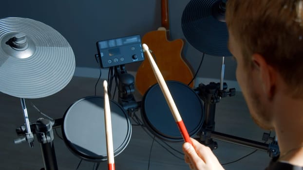 Unrecognizable musician hands hitting drum plates in recording studio. Media. Drummer hands performing solo with drumsticks