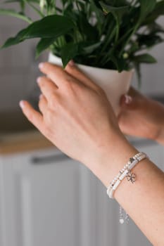 Close-up woman wearing beautiful luxury rings and bracelet. Handmade jewellery and accessories.