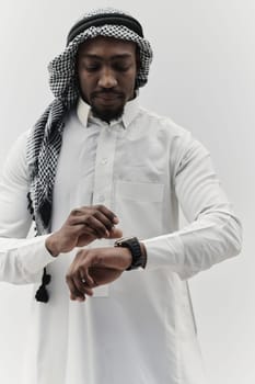 Arabic entrepreneur captures a self-portrait against an isolated white background, radiating ambition, determination, and corporate charisma, embodying the essence of a successful and influential business leader.