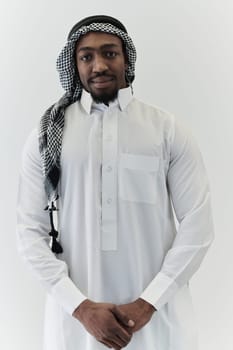 Arabic entrepreneur captures a self-portrait against an isolated white background, radiating ambition, determination, and corporate charisma, embodying the essence of a successful and influential business leader.