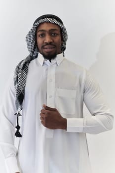 Arabic entrepreneur captures a self-portrait against an isolated white background, radiating ambition, determination, and corporate charisma, embodying the essence of a successful and influential business leader.