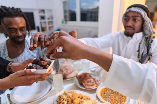 In a poignant close-up, the diverse hands of a Muslim family delicately grasp fresh dates, symbolizing the breaking of the fast during the holy month of Ramadan, capturing a moment of cultural unity, shared tradition, and the joyous anticipation of communal iftar.