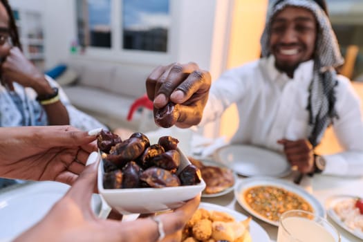 In a poignant close-up, the diverse hands of a Muslim family delicately grasp fresh dates, symbolizing the breaking of the fast during the holy month of Ramadan, capturing a moment of cultural unity, shared tradition, and the joyous anticipation of communal iftar.