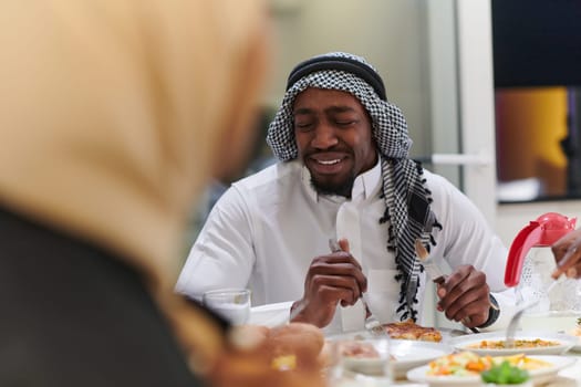 A traditional and diverse Muslim family comes together to share a delicious iftar meal during the sacred month of Ramadan, embodying the essence of familial joy, cultural richness, and spiritual unity in their shared celebration.