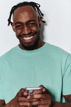 African American teenager engages with his smartphone against a pristine white background, encapsulating the essence of contemporary digital connectivity and youth culture.