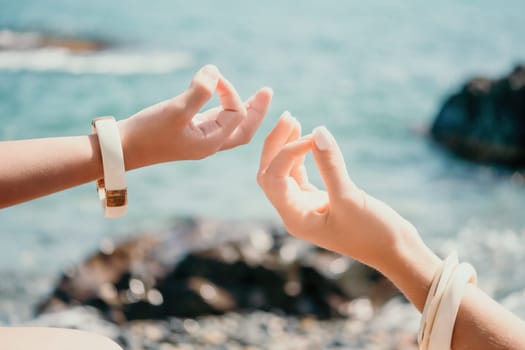 Close up Hand Gesture of Woman Doing an Outdoor Lotus Yoga Position. Close up. Blurred background