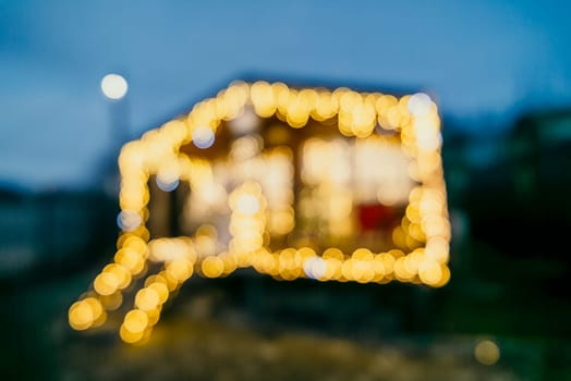 bright Christmas lights on house, creating decorative illumination in evening scene