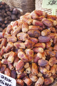 many date fruits display for sale at local market .