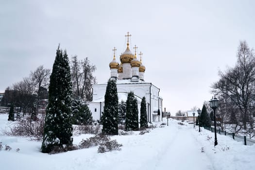 Park on the territory of the Solotchinsky monastery on a cloudy winter day