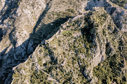 Aerial view of the St. John fortress and serpentine roads in the mountains. Kotor, Montenegro. High quality photo