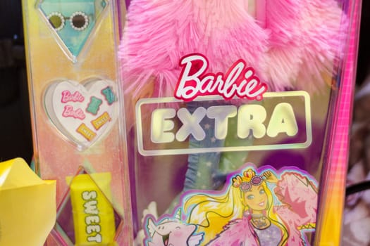 Tyumen, Russia-November 25, 2023: Barbie extra logo, produced by the American toy manufacturing company Mattel, Inc. and released to the market in March 1959