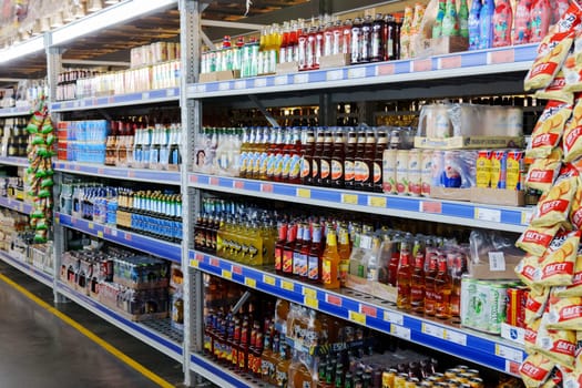 Tyumen, Russia-December 11, 2023: Shop windows with alcohol, beer. Beer in bottles and tin cans.