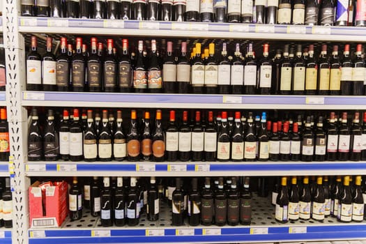 Tyumen, Russia-December 11, 2023: Metro Cash Carry Supermarket. A showcase with wine in the assortment.