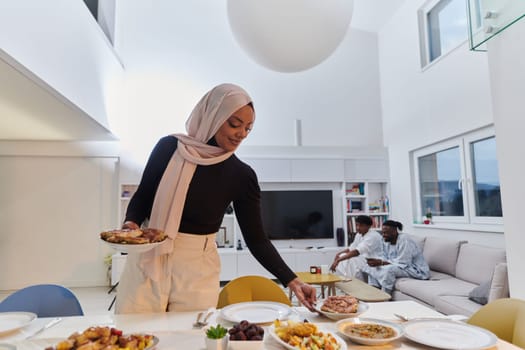 A young Arab woman gracefully prepares iftar for her family, delicately serving the table in the sacred month of Ramadan, capturing the essence of familial joy, cultural tradition, and spiritual devotion.