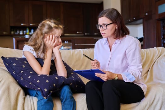 Individual therapy session for child girl with psychologist. Preteen girl talking to therapist. Education, mental health, psychology, pedagogue, psychotherapy, kids concept