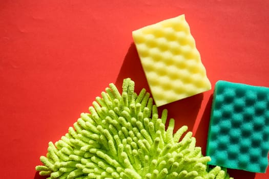 Cleaning kit isolated on white background. Set of napkins, rubber gloves and sponges.