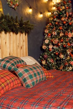 Winter Xmas Hygge home decor. Festive cozy bedroom in Skandinavian style with bed