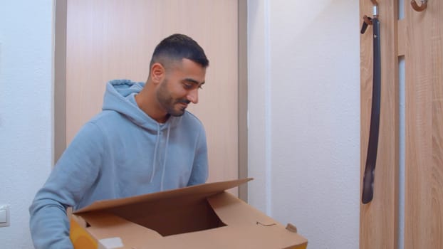 Preparation for repair. Media. A happy smiling man who brought materials for repairs to the apartment. High quality 4k footage