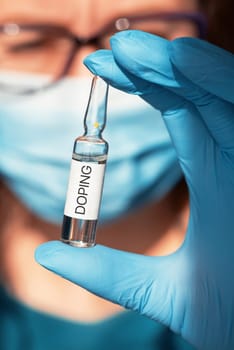 A doping ampoule in a nurse's hand closeup photo, sports doping addiction concept