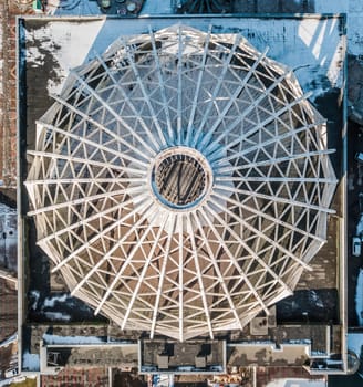 Ceiling dome with snow on top. Symmetrical view of dome. Cupola. Top view of the roof dome.