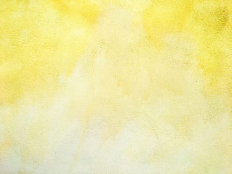 Concrete yellow colorful wall surface texture. Abstract grunge bright illuminating color background. Copyspace.