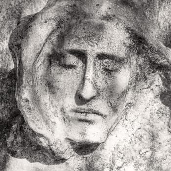 Portrait photo of Jesus Christ statue. Unbearable pain in mind.