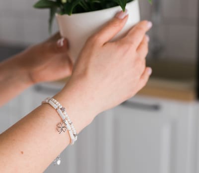 Close-up woman wearing beautiful luxury rings and bracelet. Handmade jewellery and accessories.