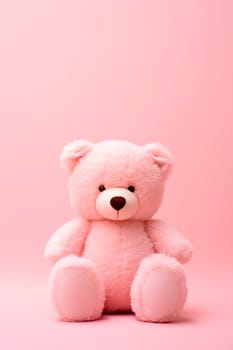 Pink teddy bear on a pink background. Selective focus. toy.