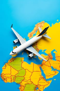 An airplane on a blue and yellow map background. Selective focus. Ukraine.