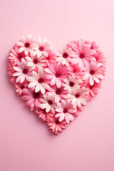 Heart of flowers on a pink background. Selective focus. Nature.
