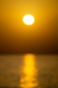 Dawn at sea. Sunrise on the sea. Flying birds. Blurred background.