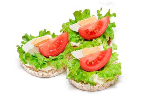 Rice Cake Sandwiches with Tomato, Lettuce and Egg - Isolated on White. Easy Breakfast. Diet Food. Quick and Healthy Sandwiches. Crispbread with Tasty Filling. Healthy Dietary Snack - Isolation
